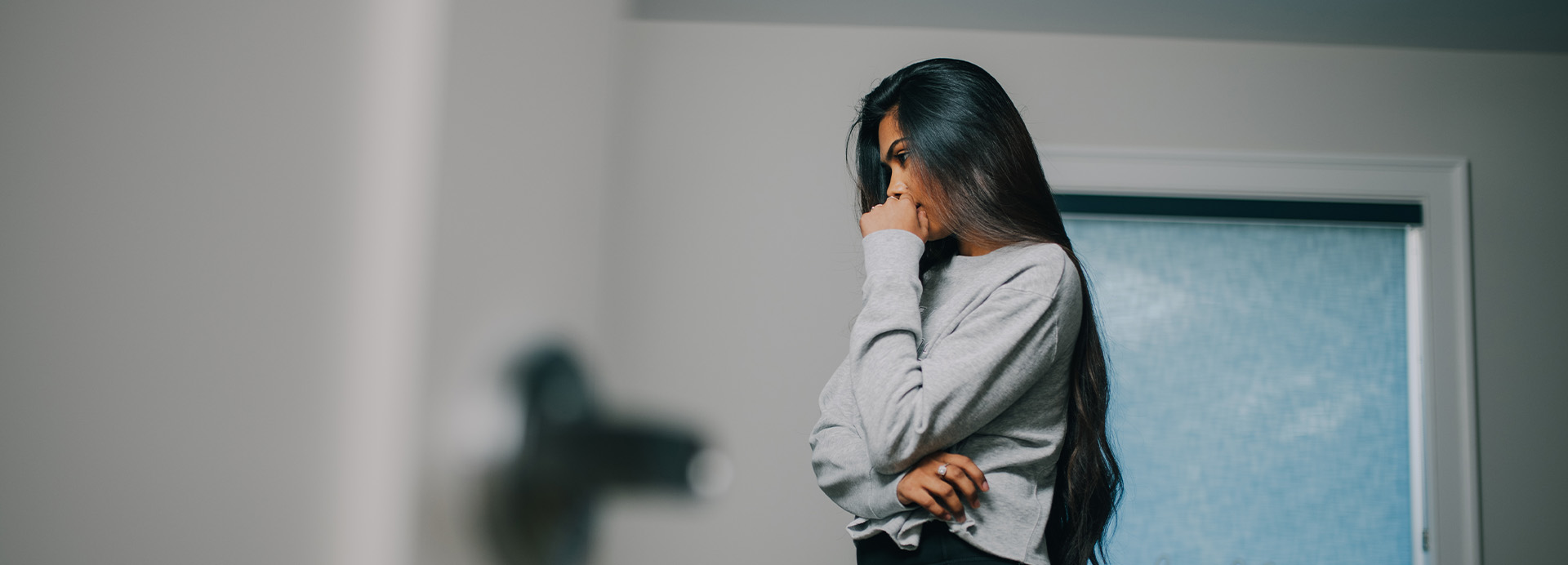 Woman client in her room grappling with depression consequences.